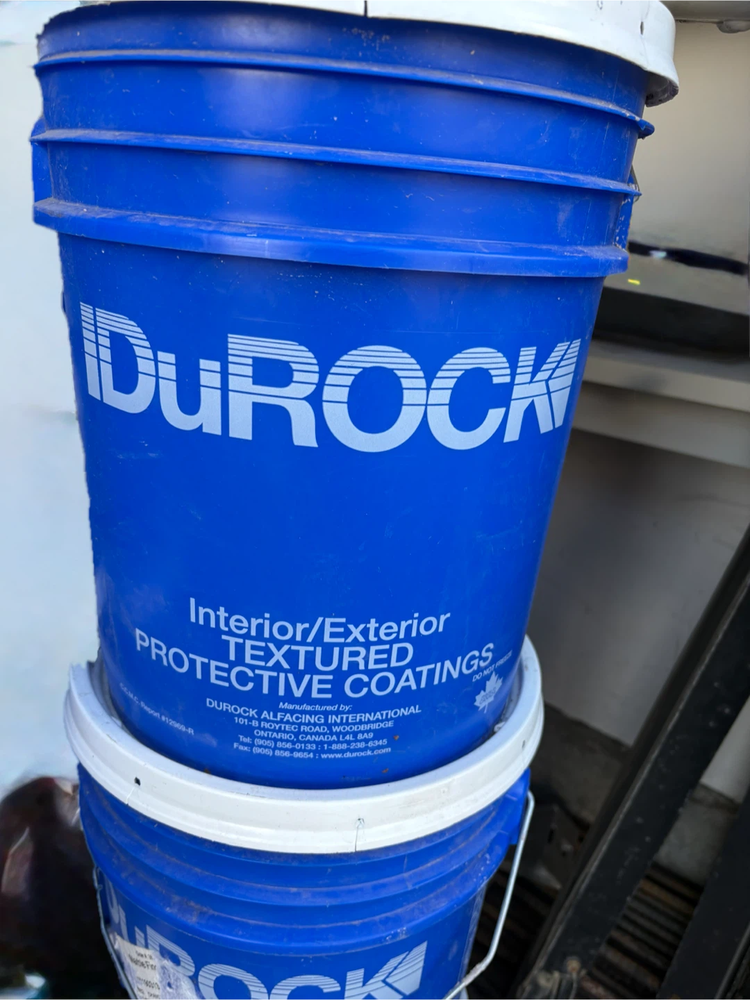 Large buckets of stucco