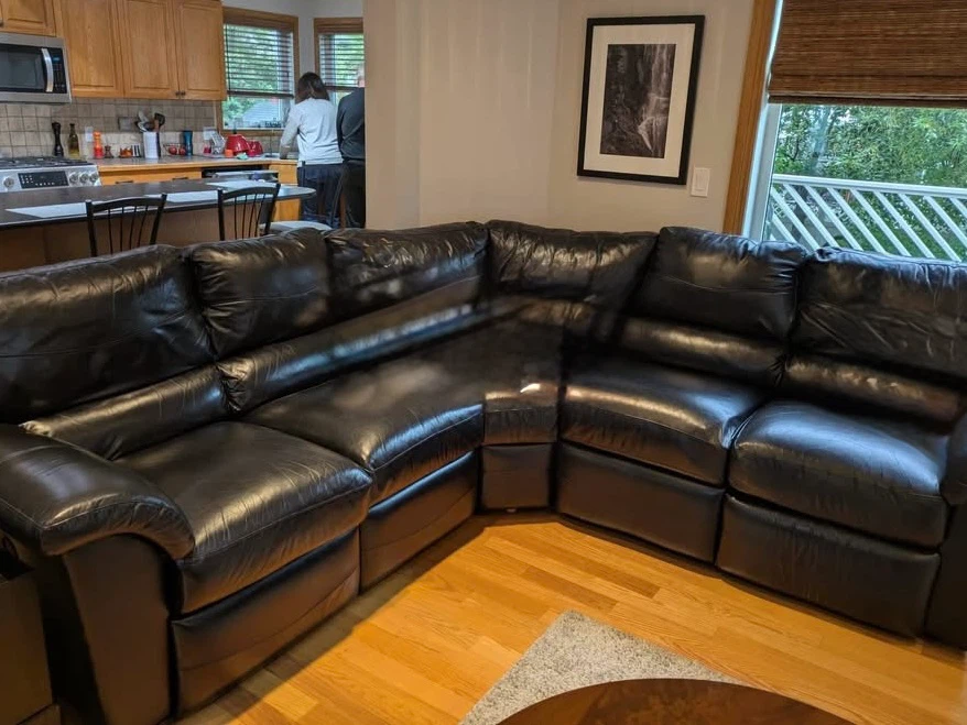 Black leather sectional with two recliners