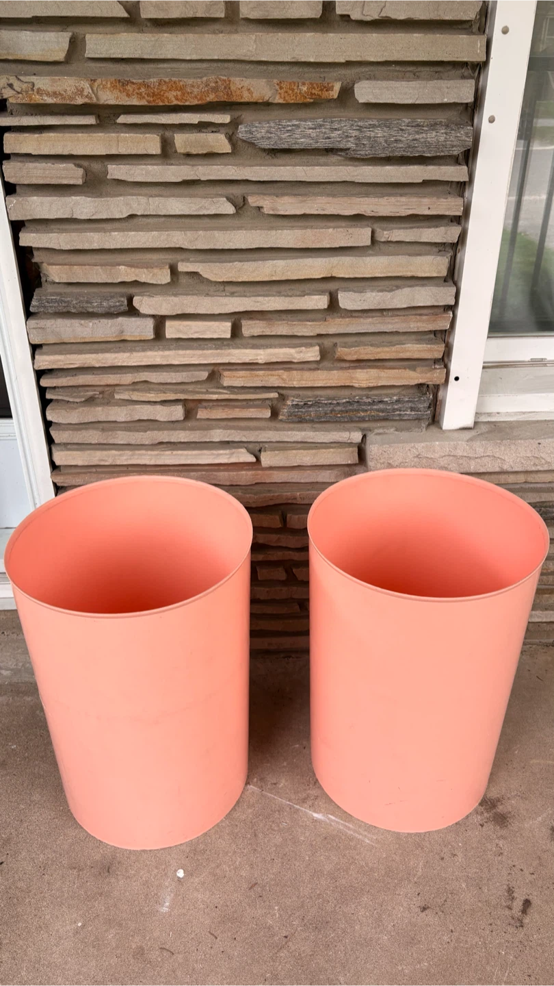 Set of two coral pink plastic waste baskets