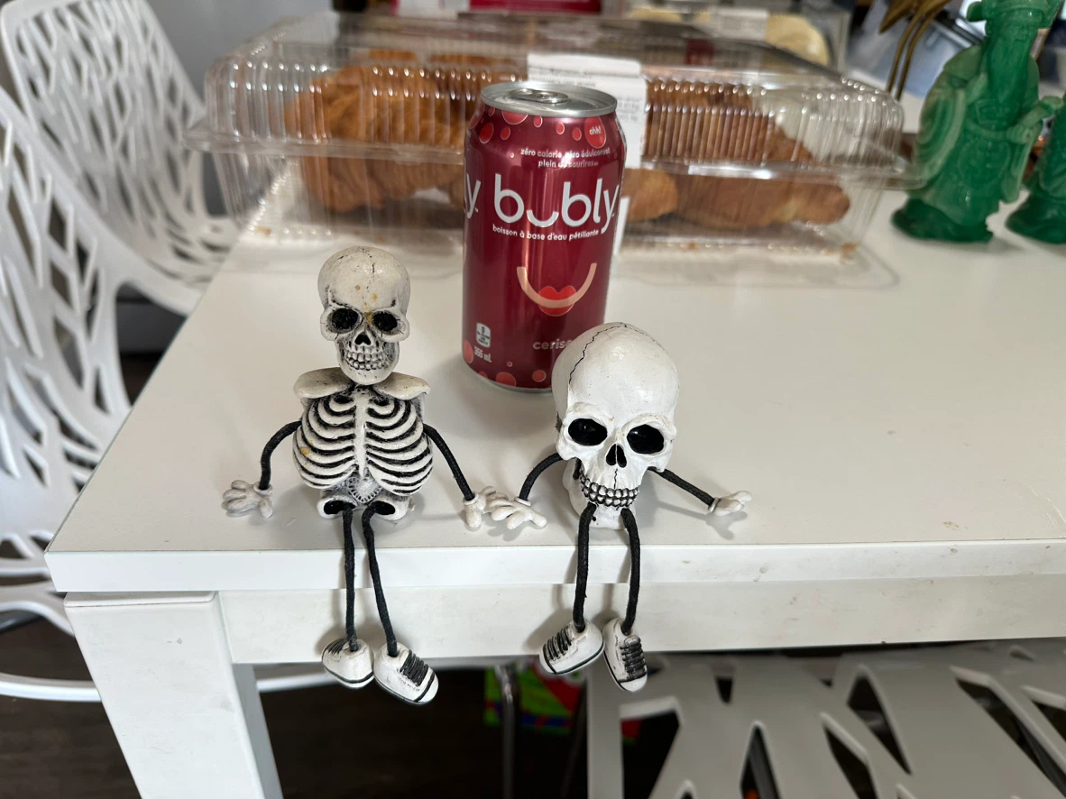 Set of two skeleton shelf sitters