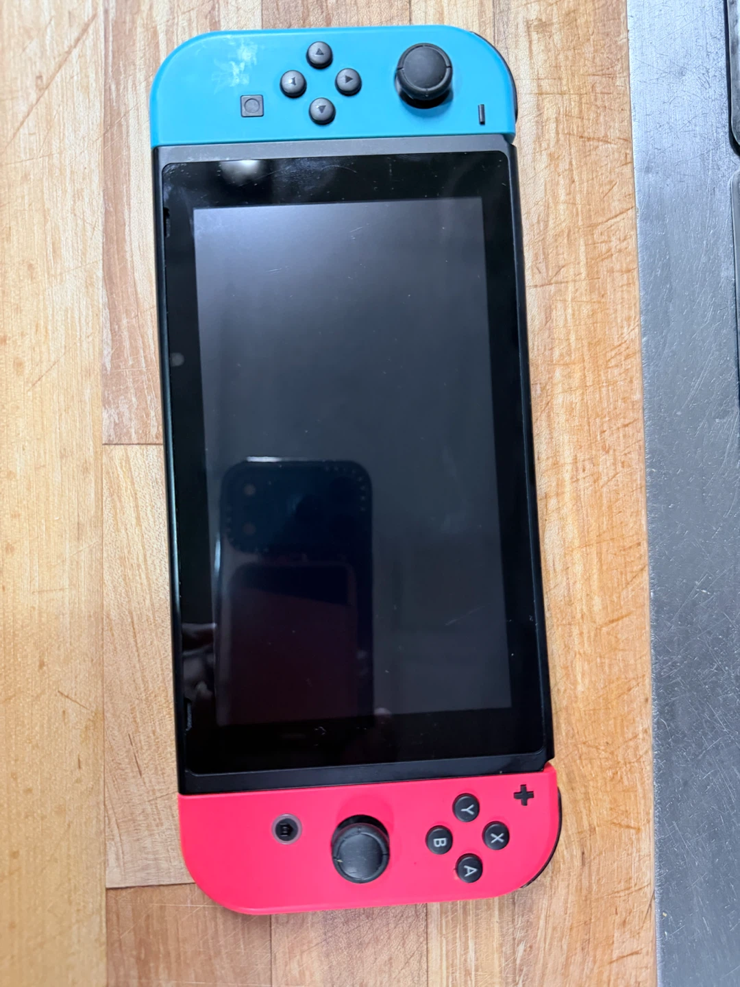 Nintendo Switch Console with Neon Blue and Red Joy-Con