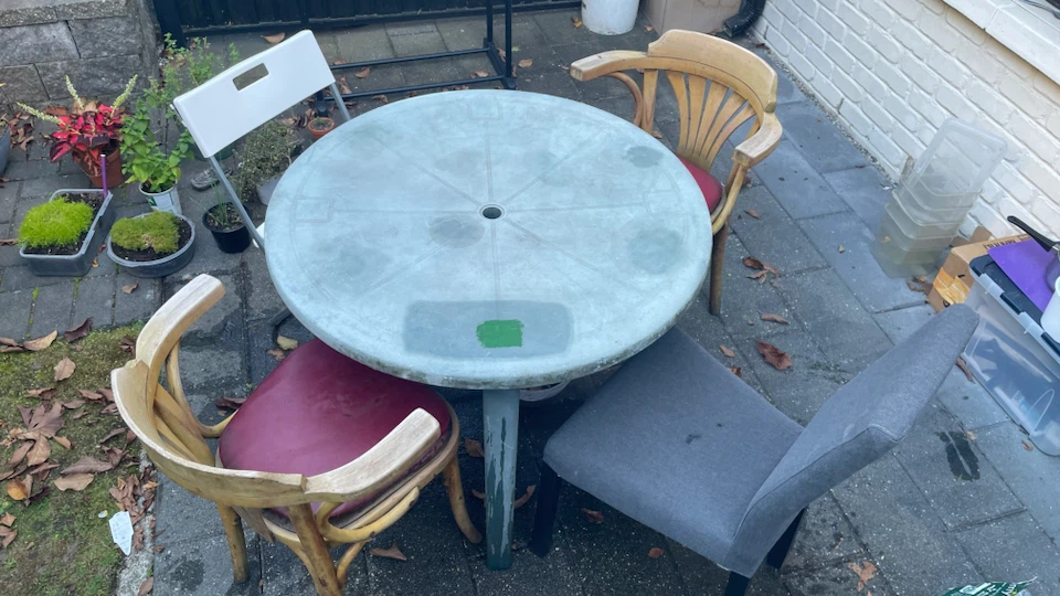 Outdoor patio set with table and four assorted chairs