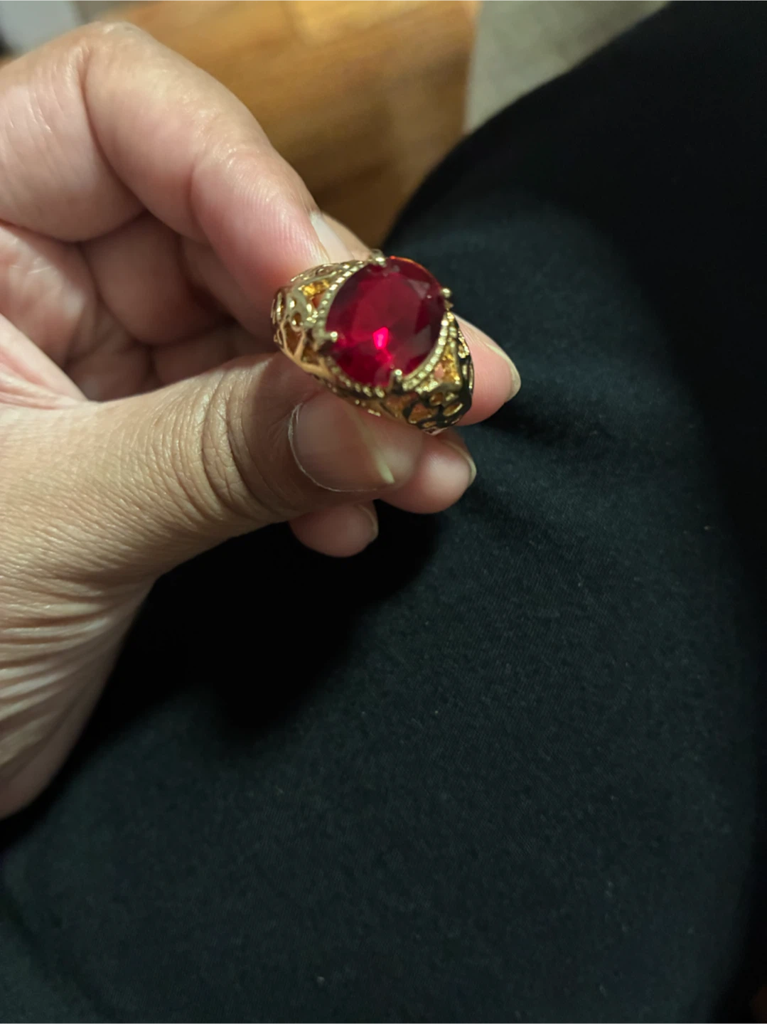 Gold-tone ring with red stone
