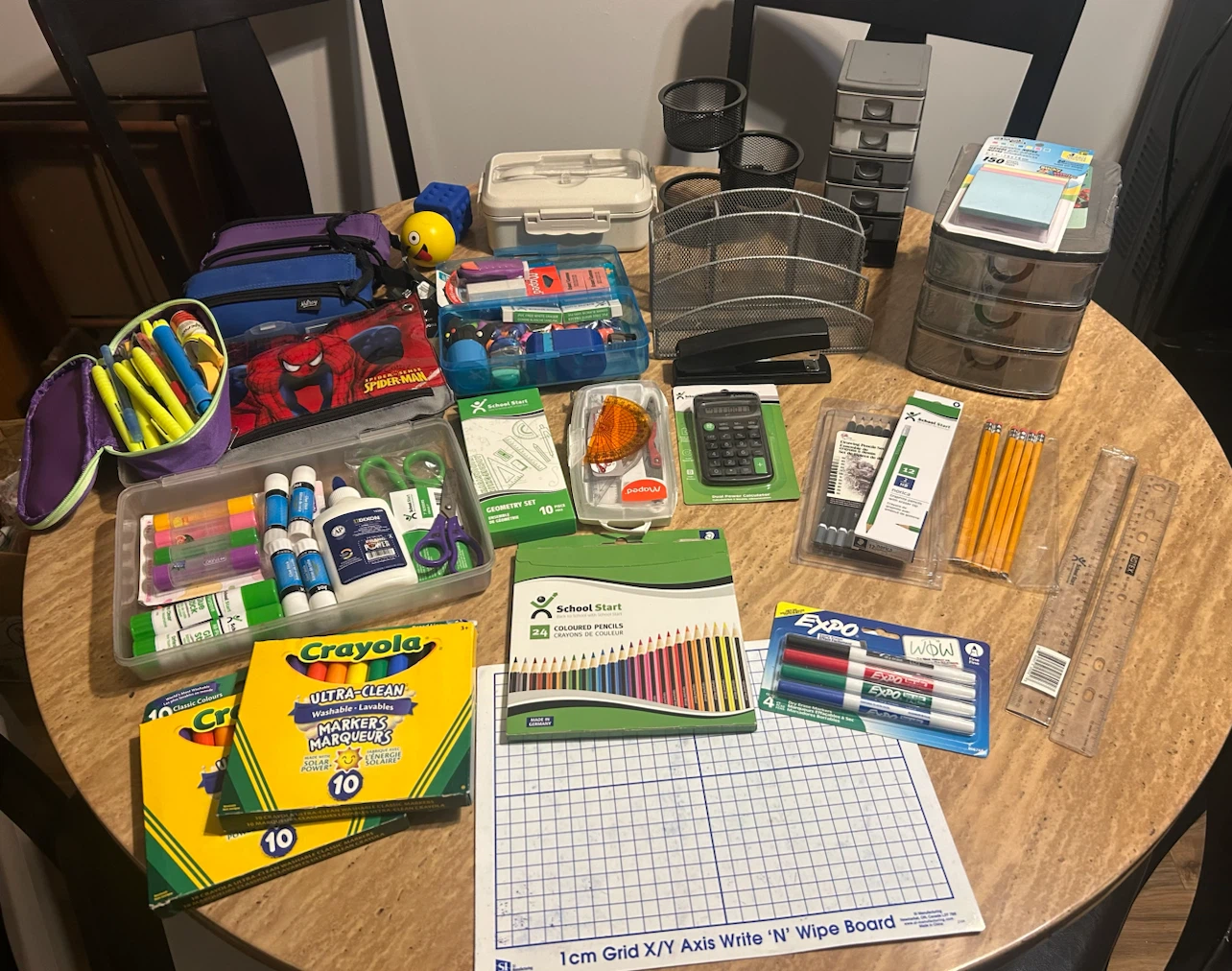 Large assortment of school supplies and books