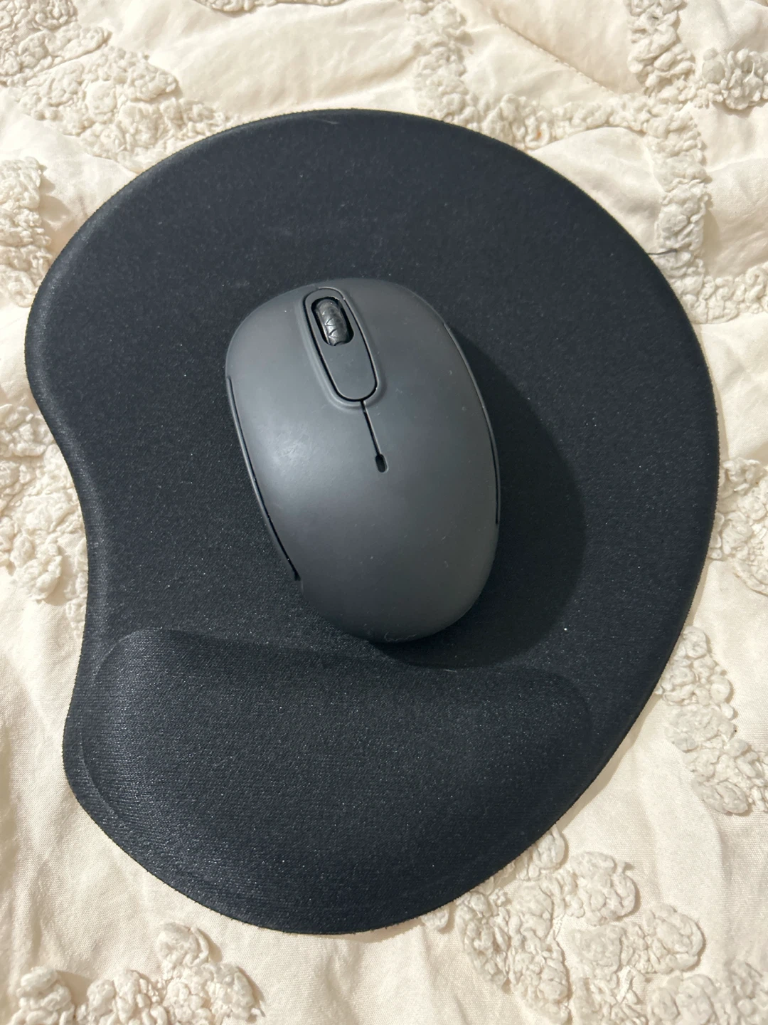 Black wireless mouse and mouse pad