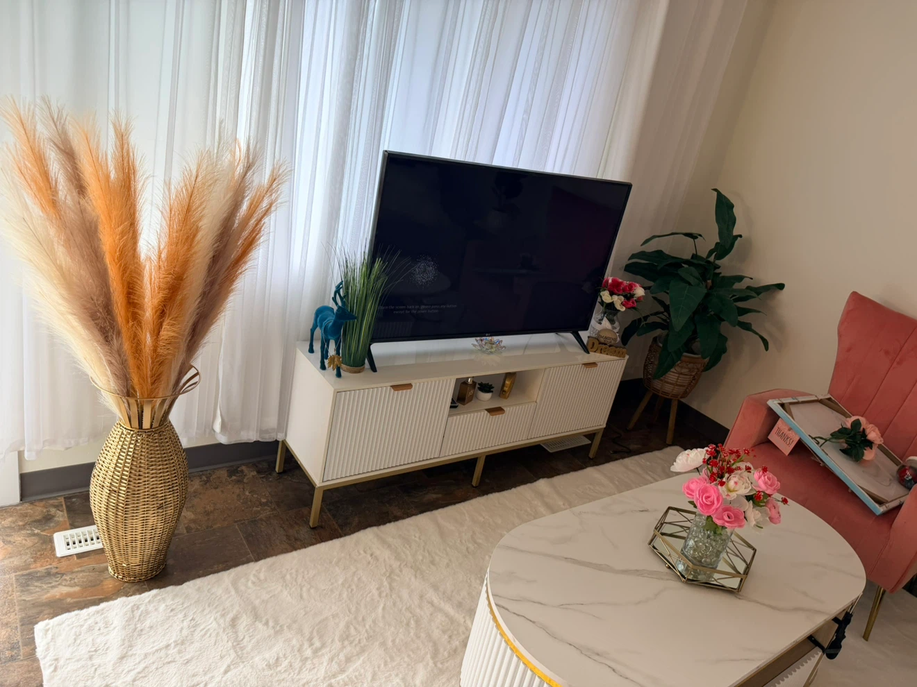 Modern white and gold TV stand with ribbed doors