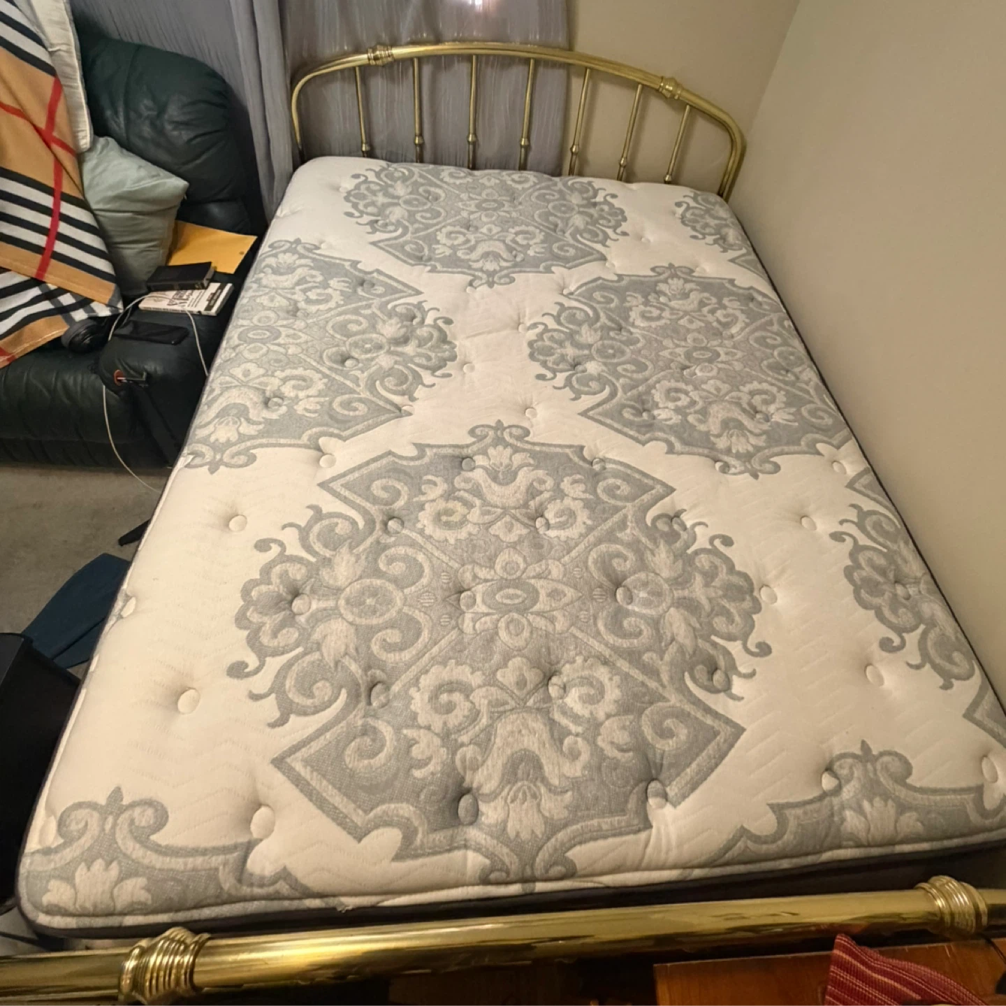 Double size mattress with gold-tone brass bed frame