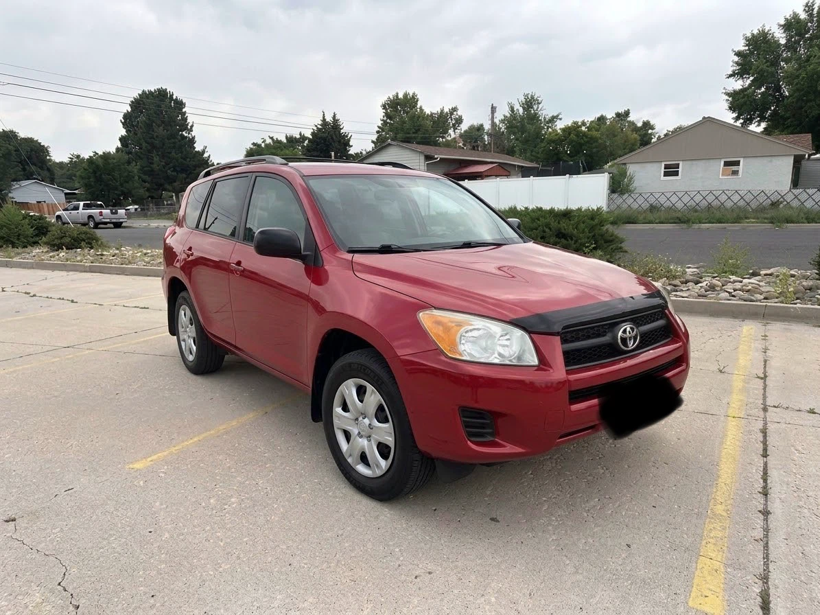 Red Toyota RAV4 SUV