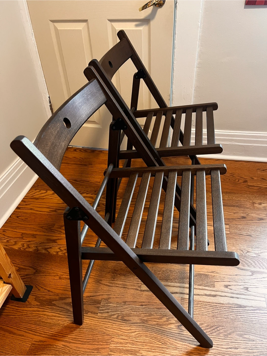 Two IKEA FRÖSVI wooden folding chairs