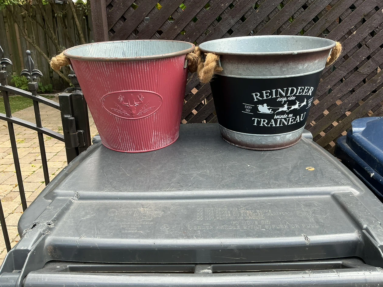 Two decorative metal buckets