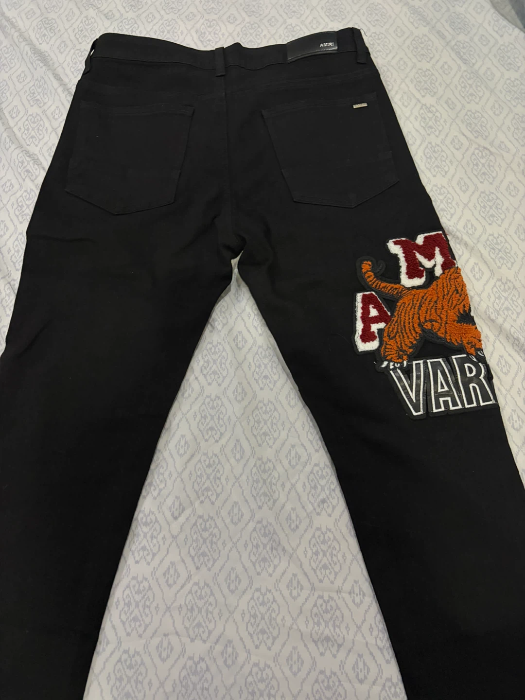 Amiri Black Tiger Varsity Jeans - photo 3
