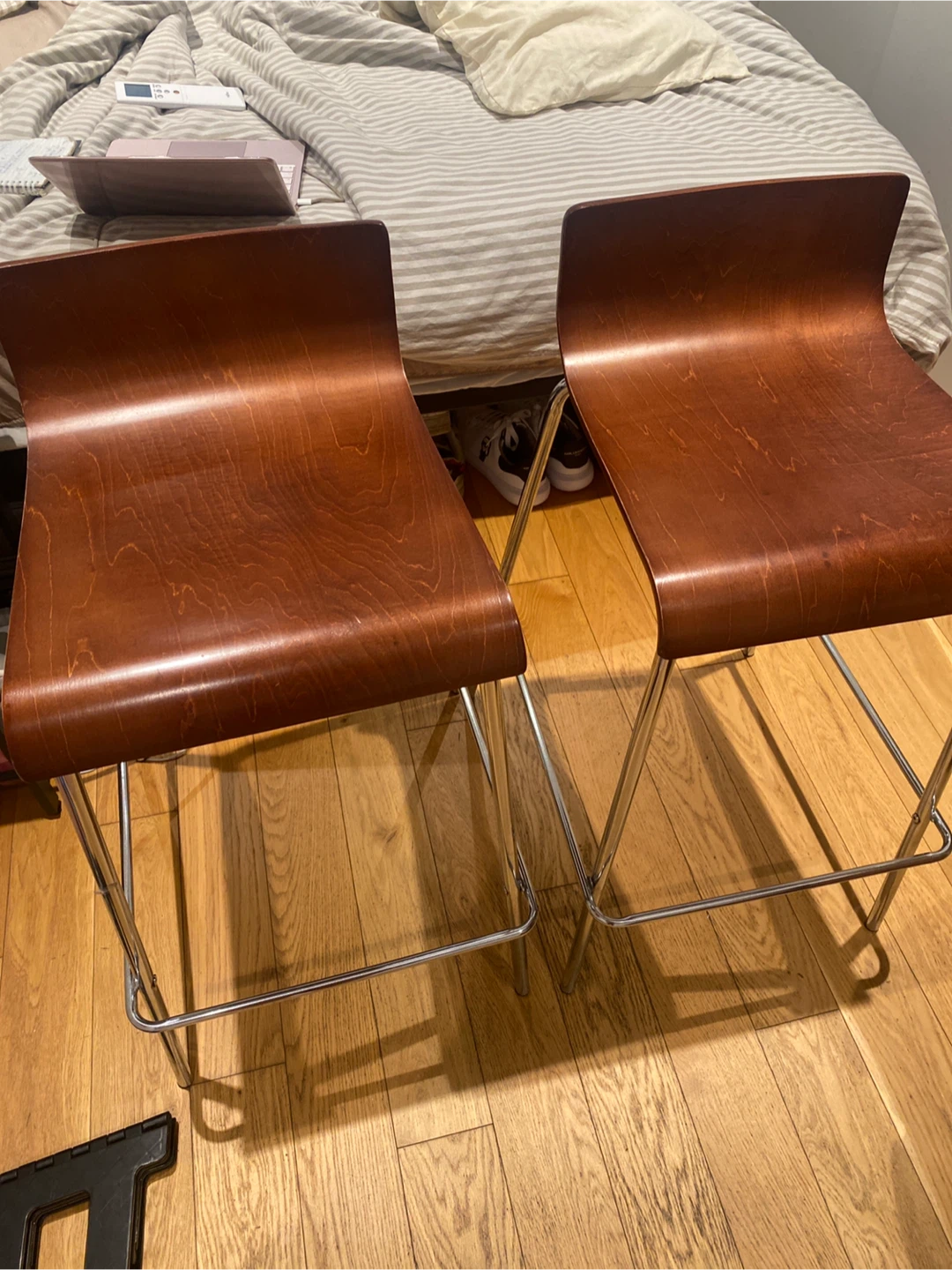 Two wooden bar stools