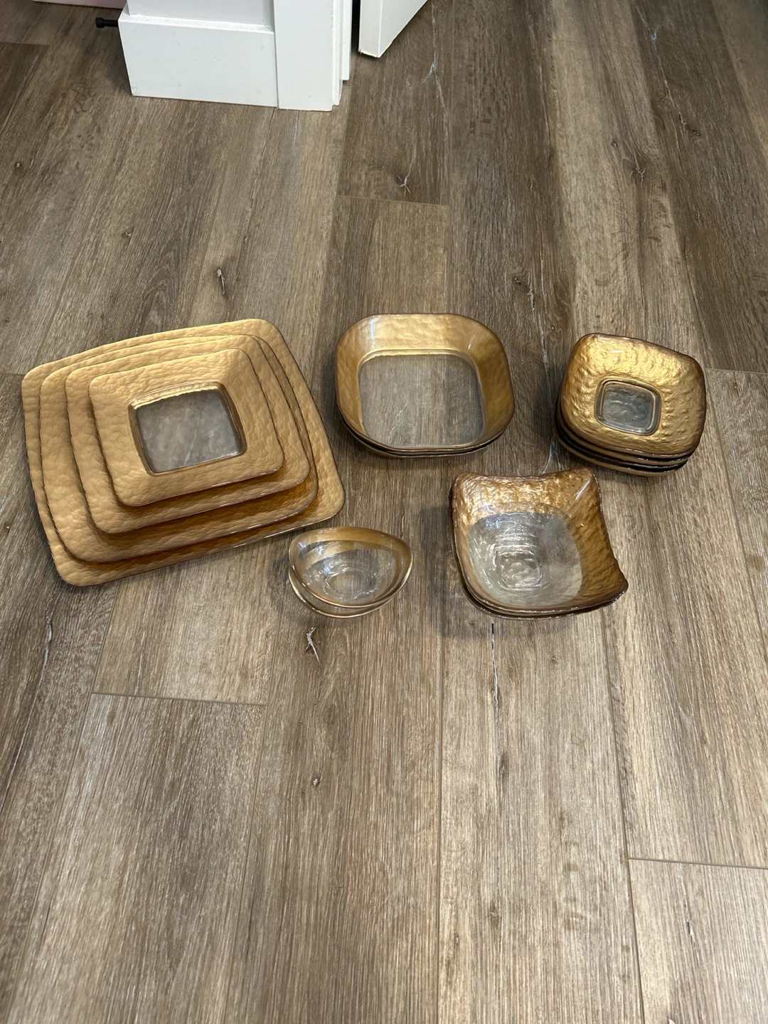 Entire set of gold-rimmed glass dinnerware