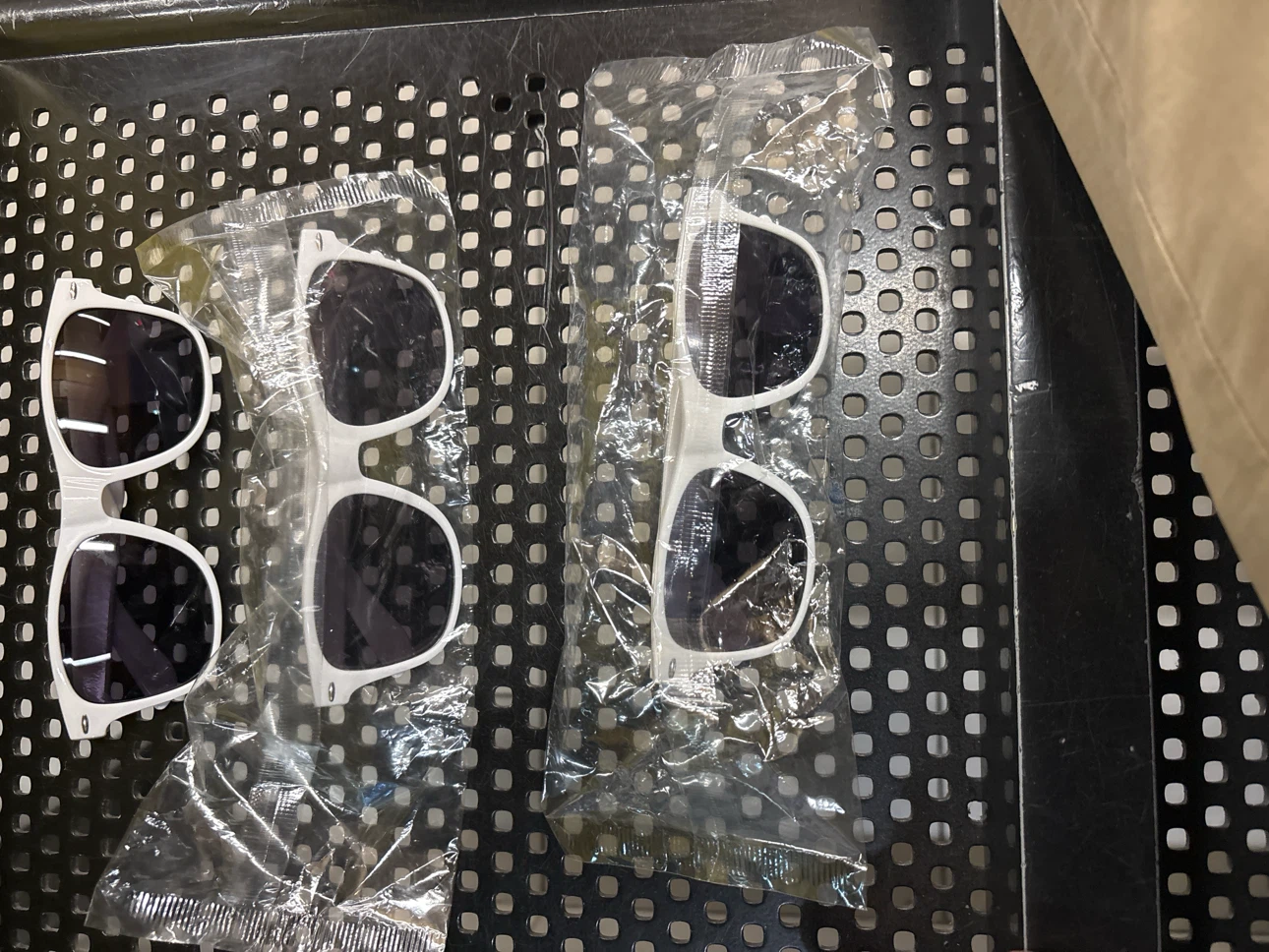 Two pairs of white sunglasses