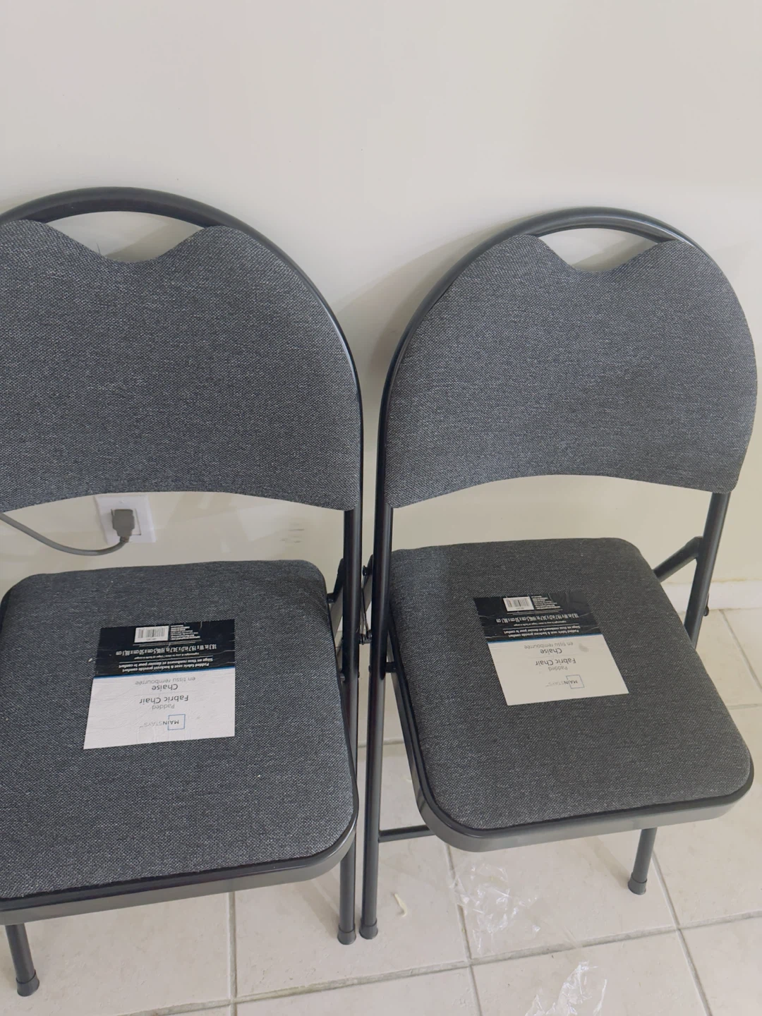 Two Mainstays Padded Fabric Folding Chairs