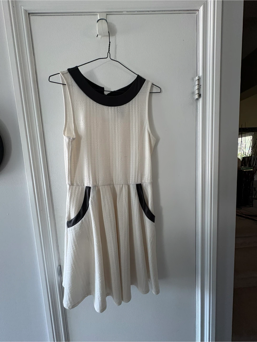 White sleeveless dress with black accents