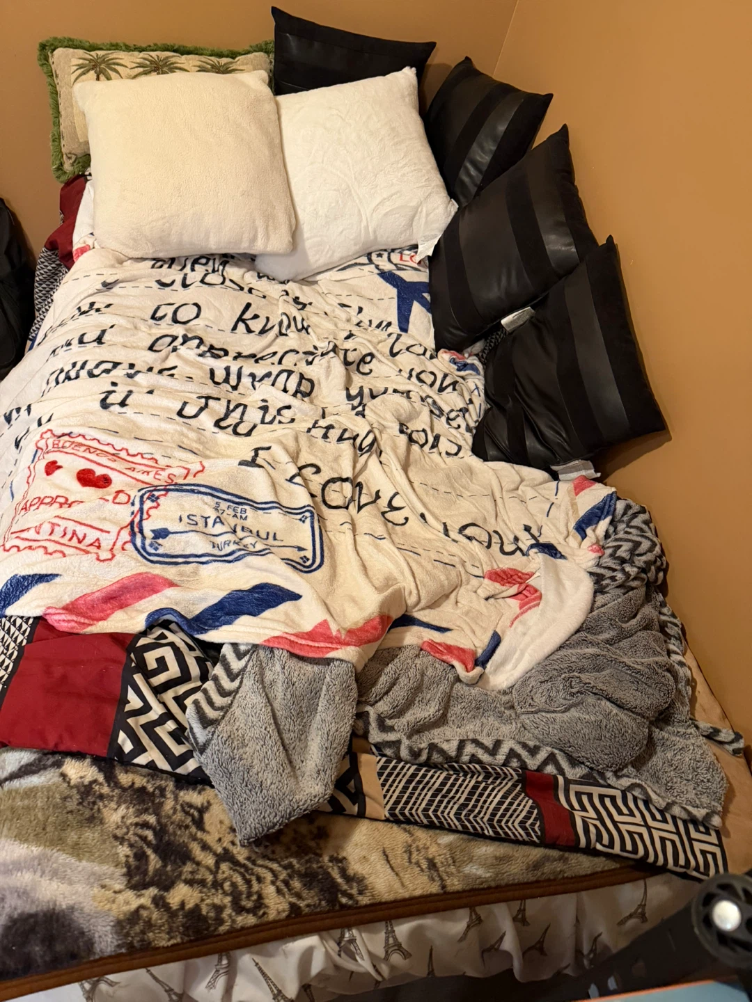 Twin bed with blankets and pillows