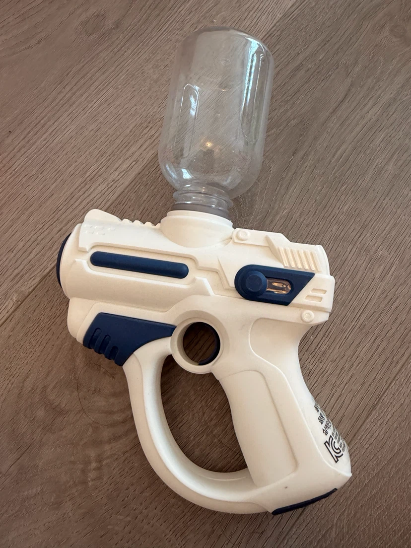Three toy bubble and water blasters