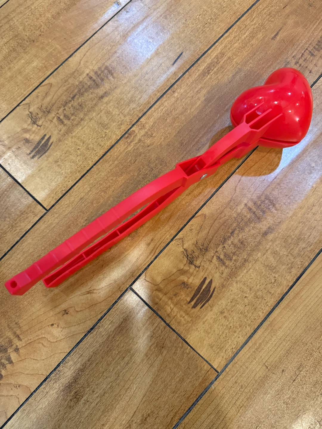 Red heart-shaped snow toy