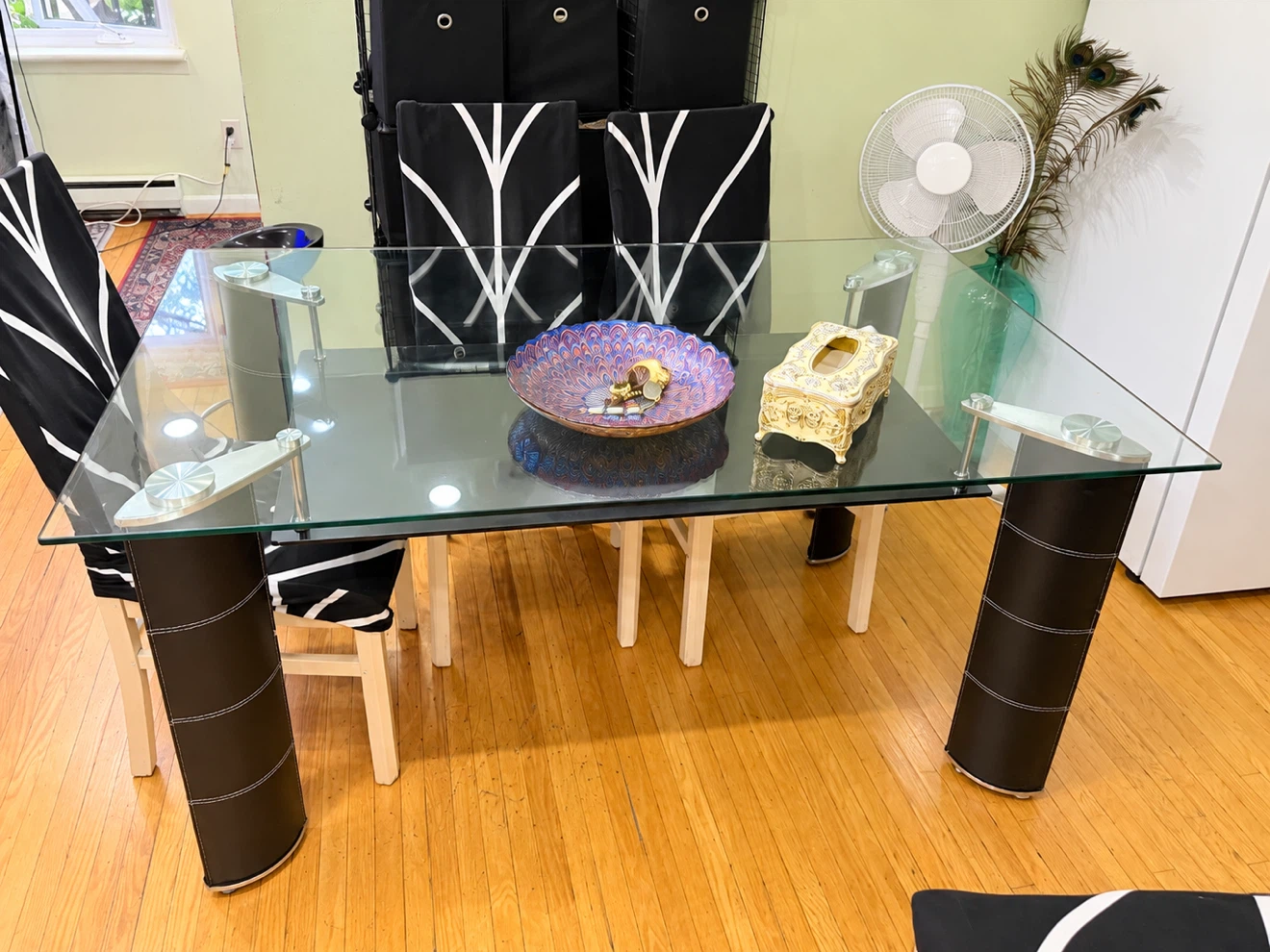 Glass Top Dining Table with Black Cylindrical Legs
