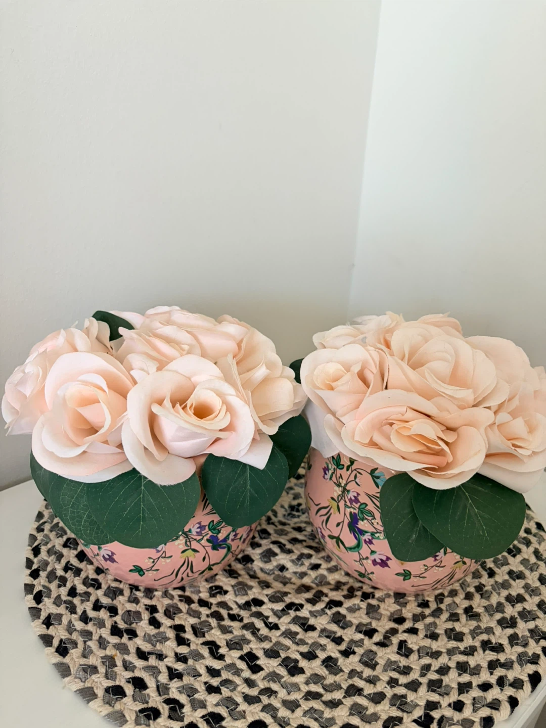 Set of two decorative floral pots with faux roses
