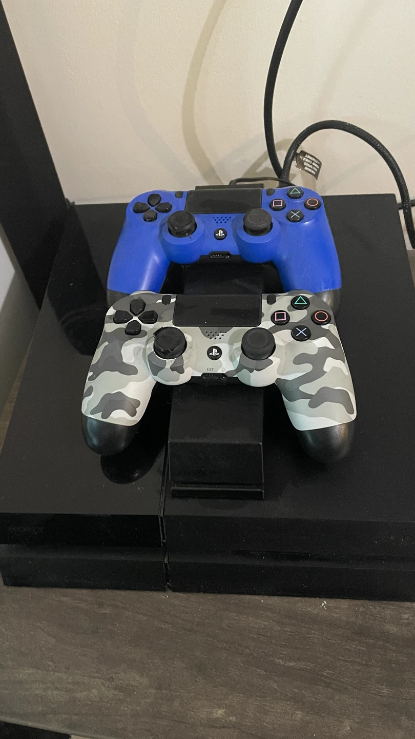 PlayStation 4 Console with Two DualShock Controllers