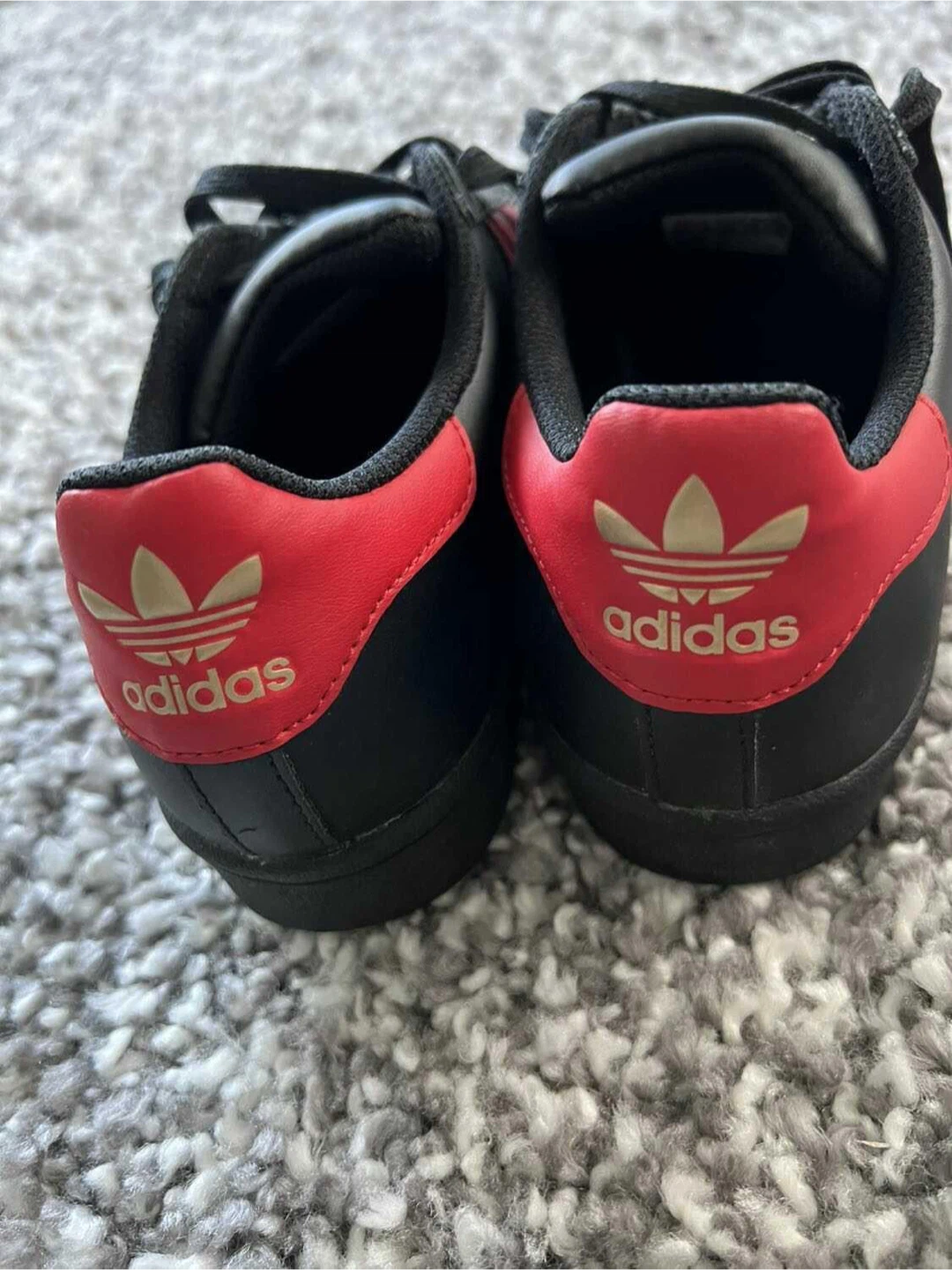 Women’s 6 Adidas Superstar black and red sneakers