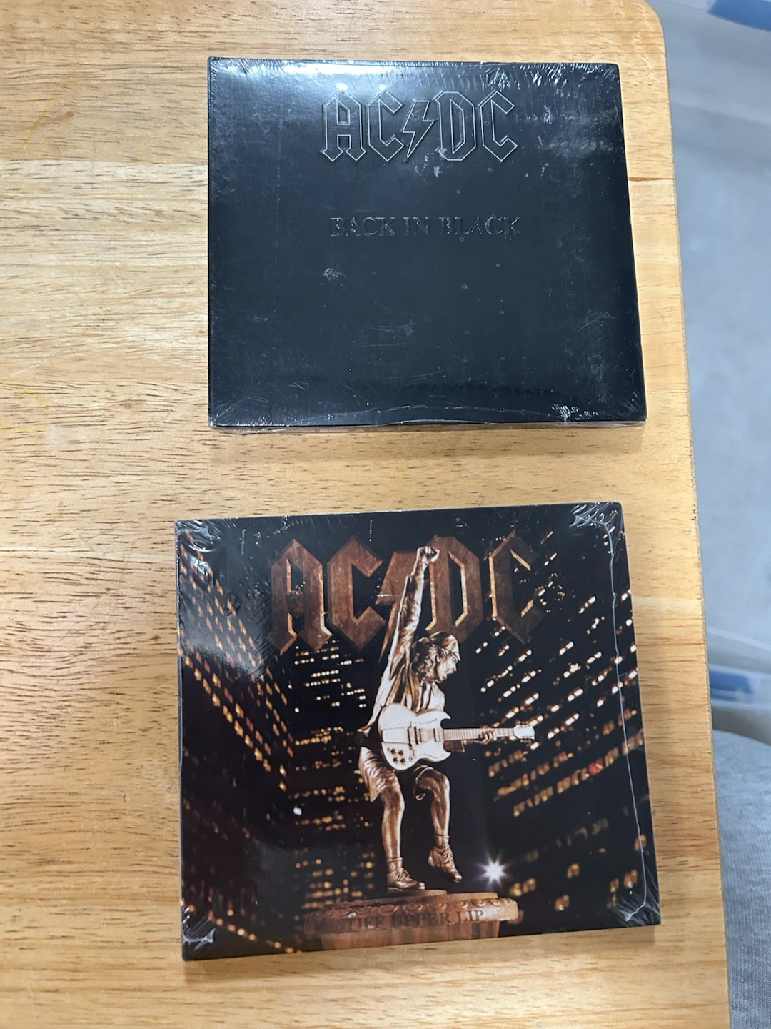 2 AC/DC CDs: Back In Black and Stiff Upper Lip