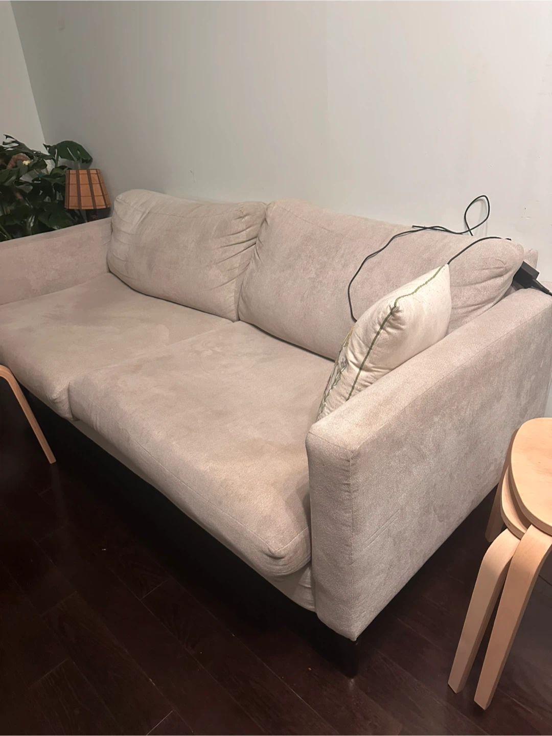 Beige two-seater sofa