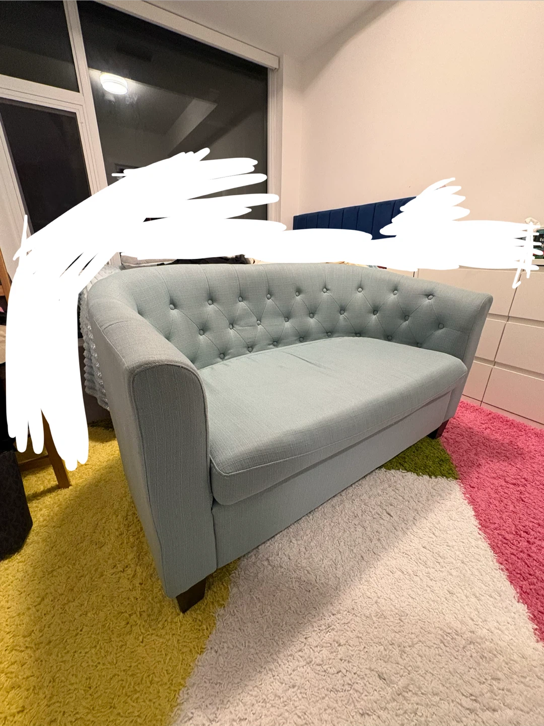 Tufted light blue loveseat