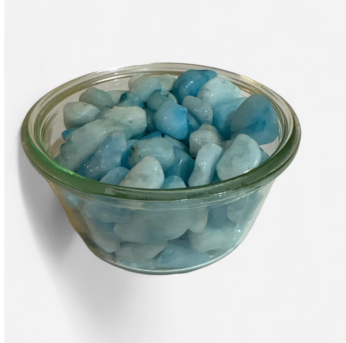Glass jar of blue aquamarine tumbled stones