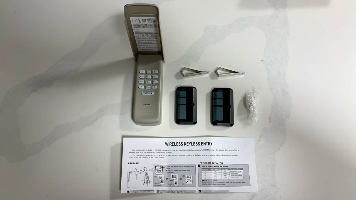 NEW - Garage Door Keypad and 2 Remote Set