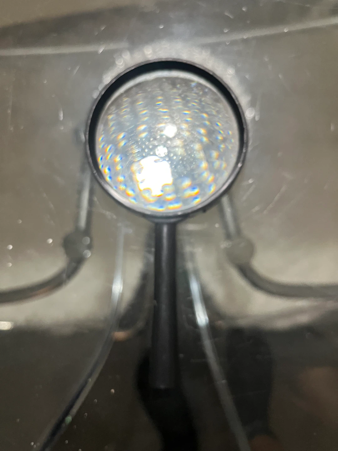 Black handheld magnifying glass