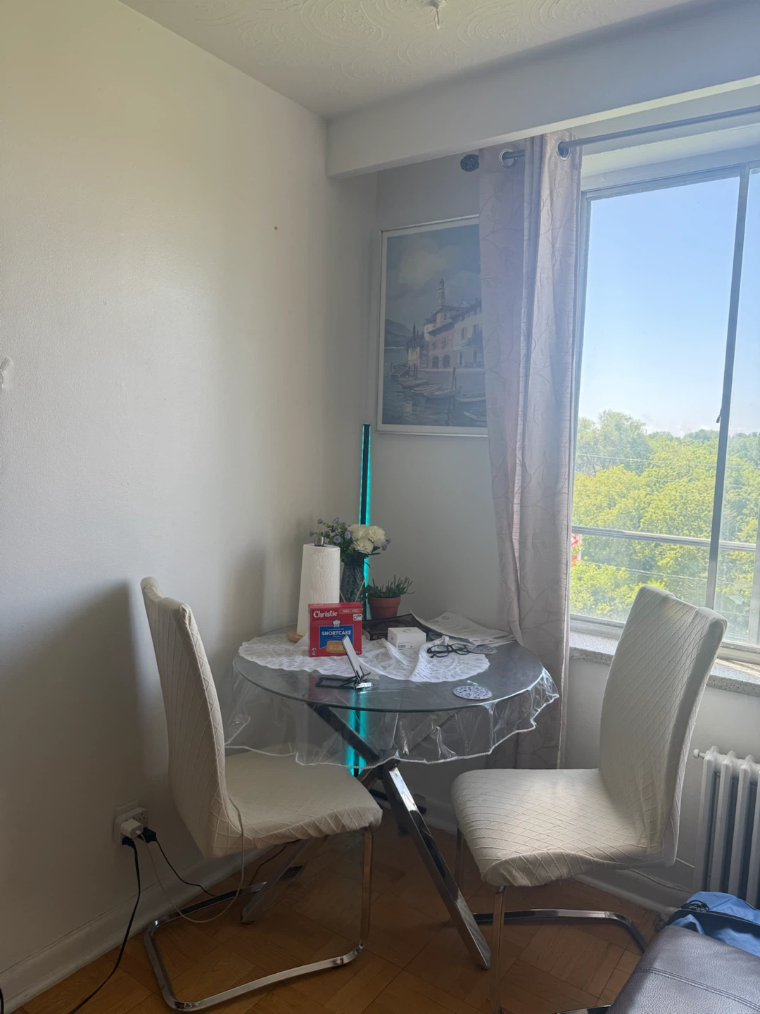 Glass dining table with two chairs