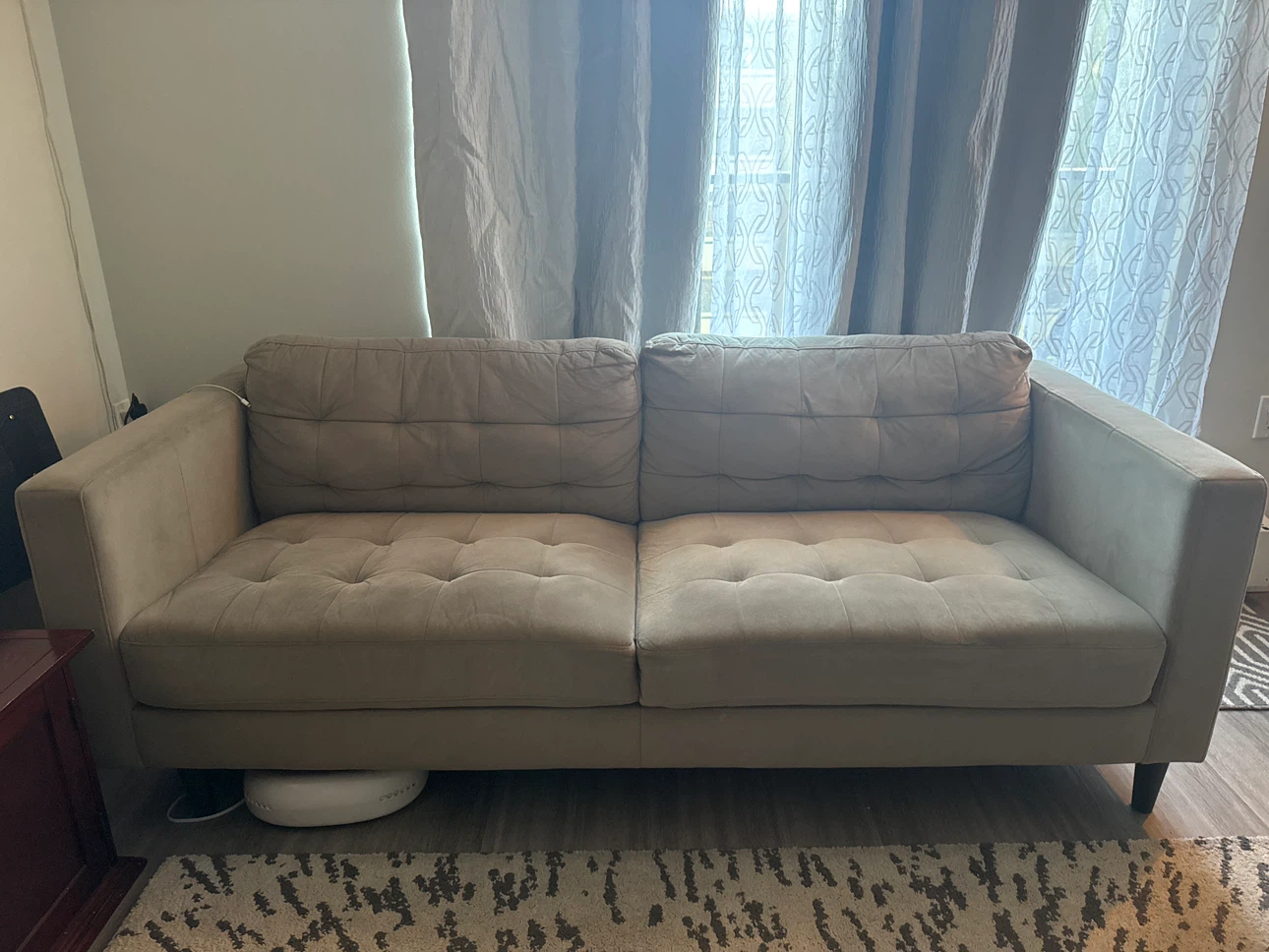 Beige tufted two-seater sofa