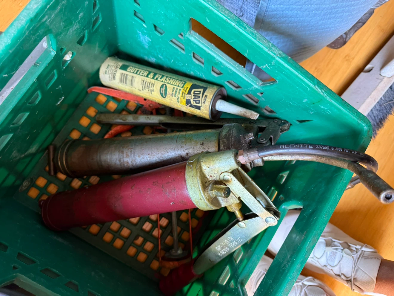 Alemite Grease Gun and DAP Gutter & Flashing Sealant