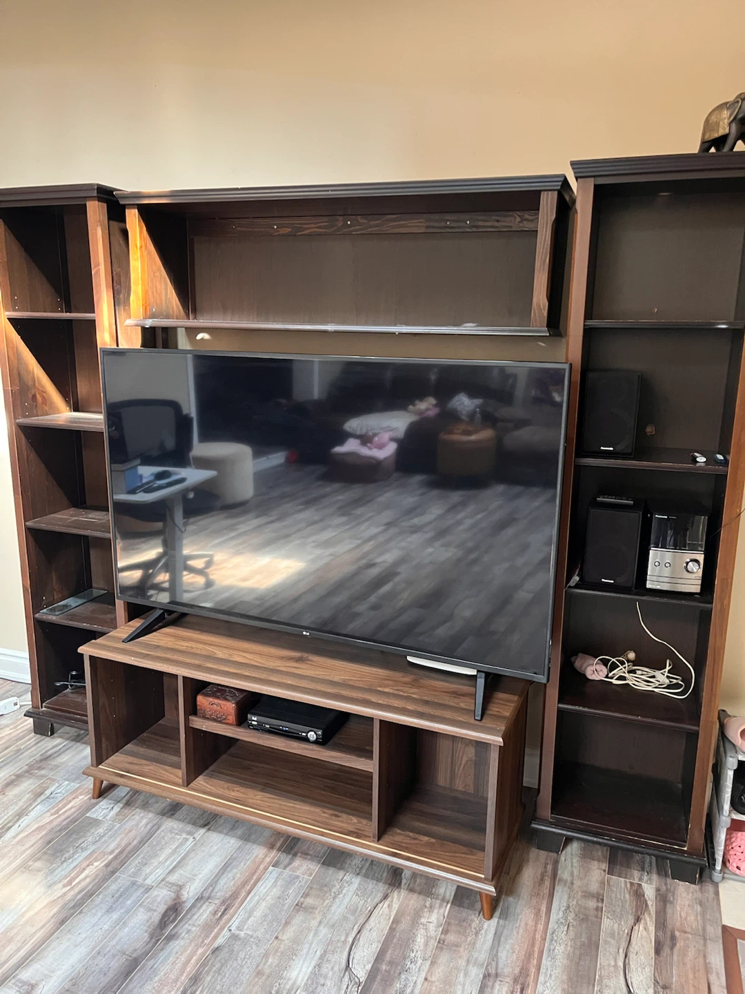 Large dark wood media wall unit with shelves