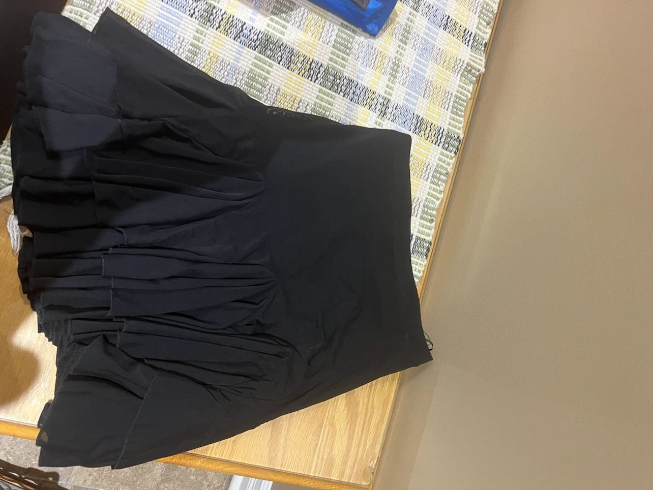 Black pleated mini skirt
