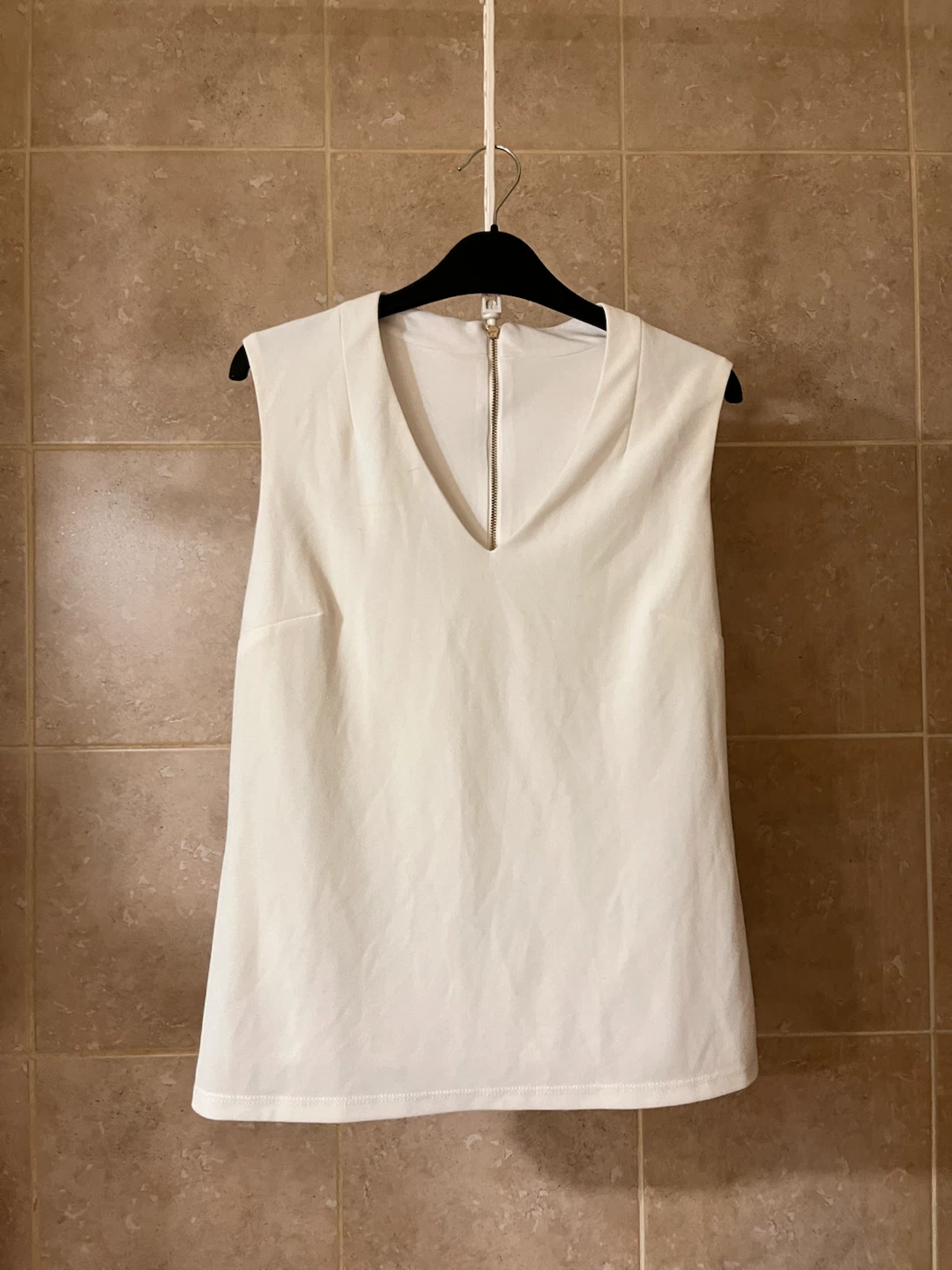 White Sleeveless V-Neck Top 🏈