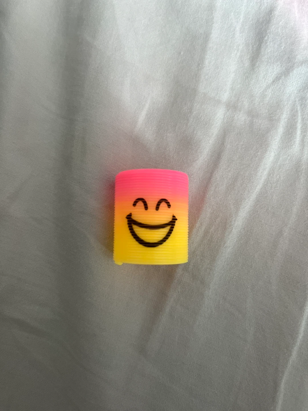 🏈 Mini Smiley Face Slinky Toy