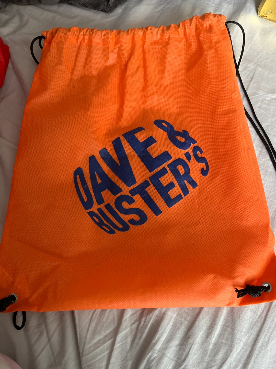 🏈 Dave & Buster's Orange Drawstring Bag
