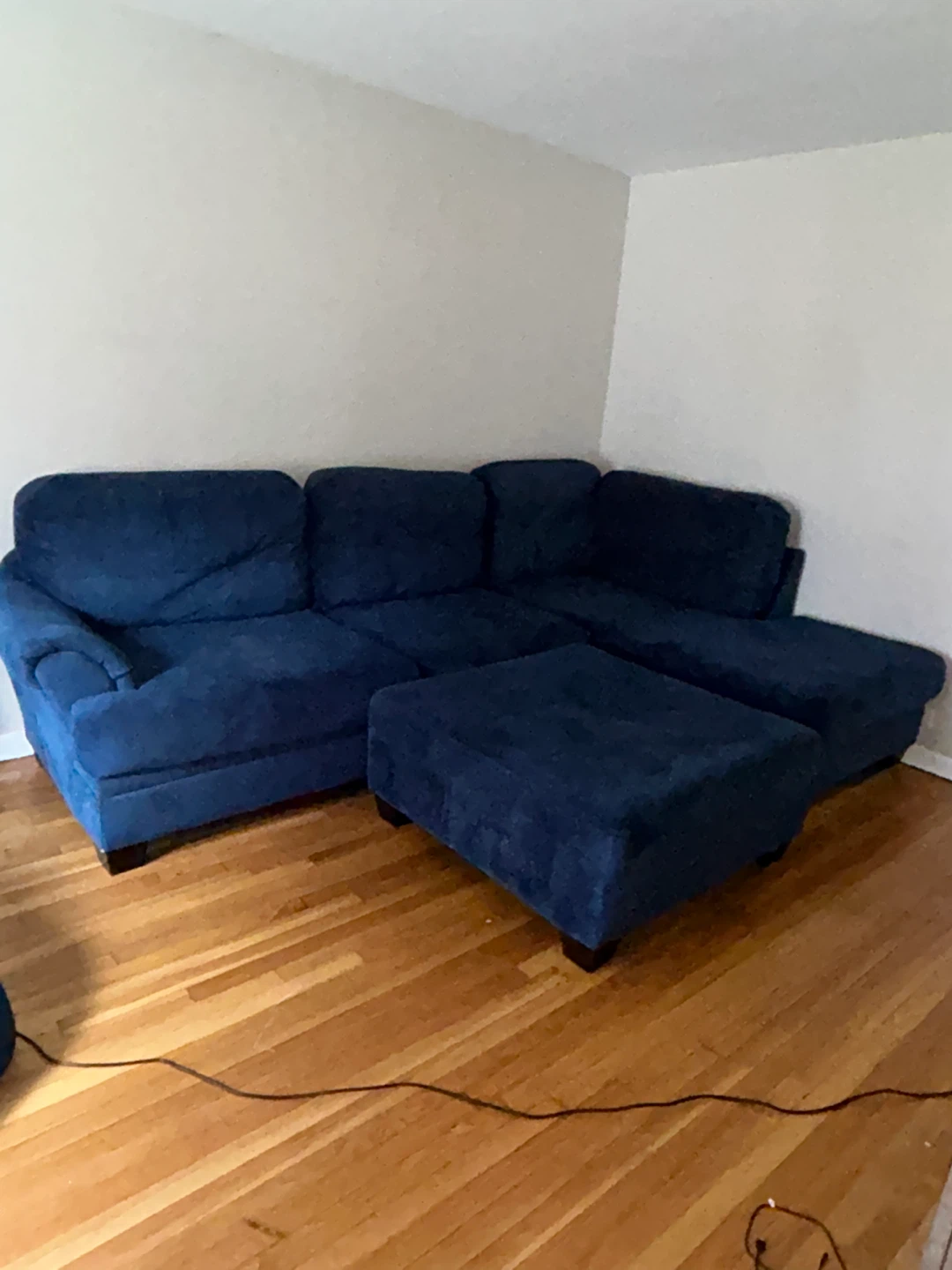 Blue sectional sofa with ottoman