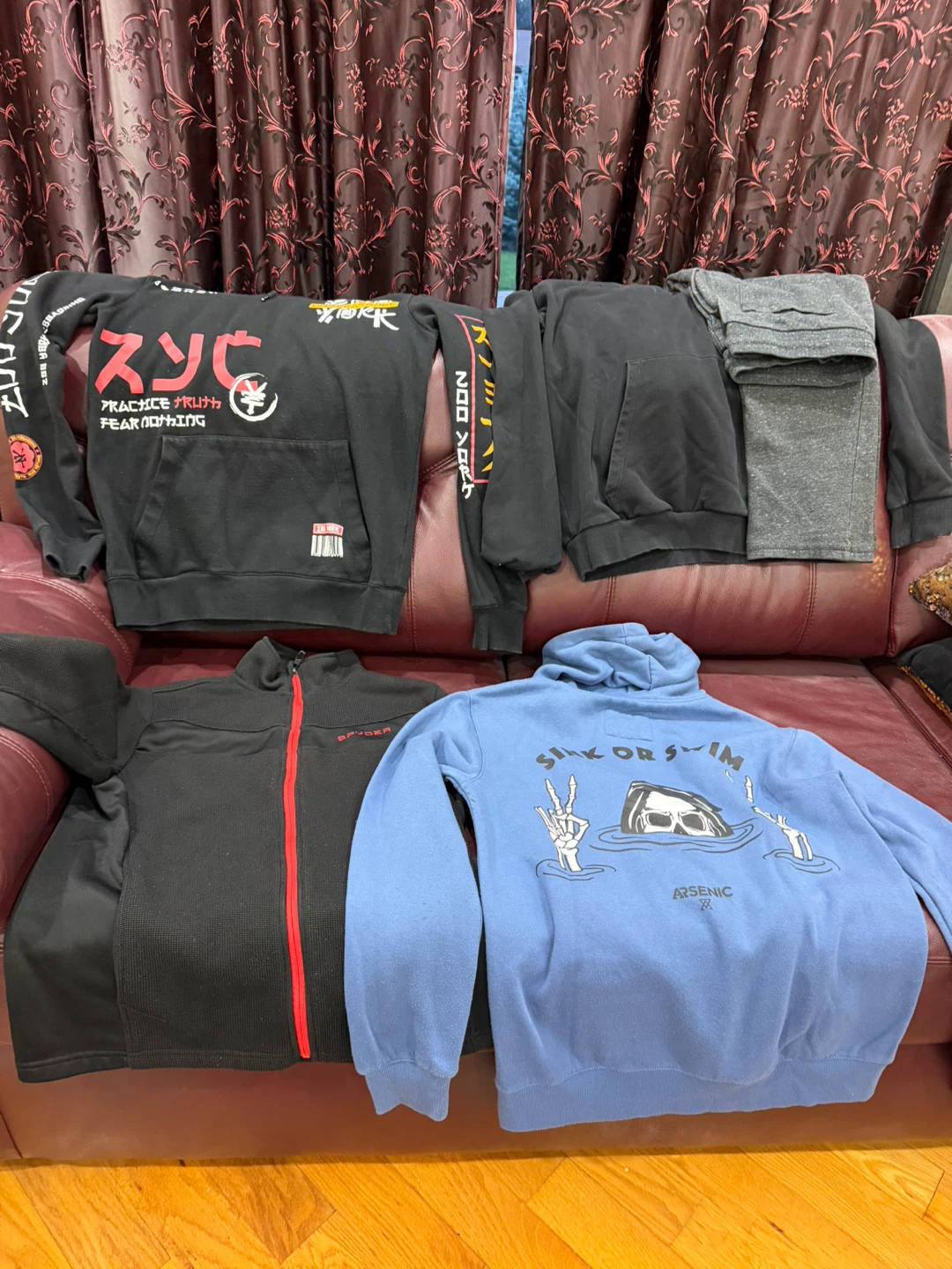 Assorted hoodies and zip-up jacket
