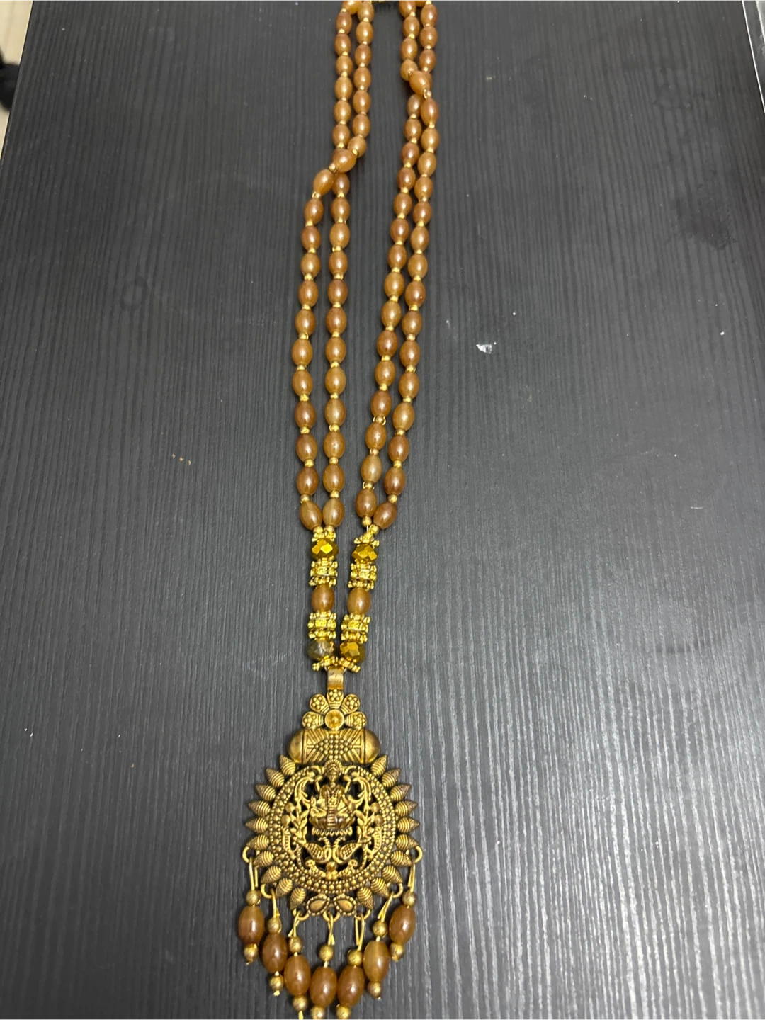 Gold-toned beaded pendant necklace