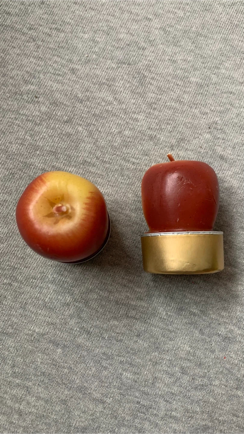 Two apple-shaped tea light candles 🏈