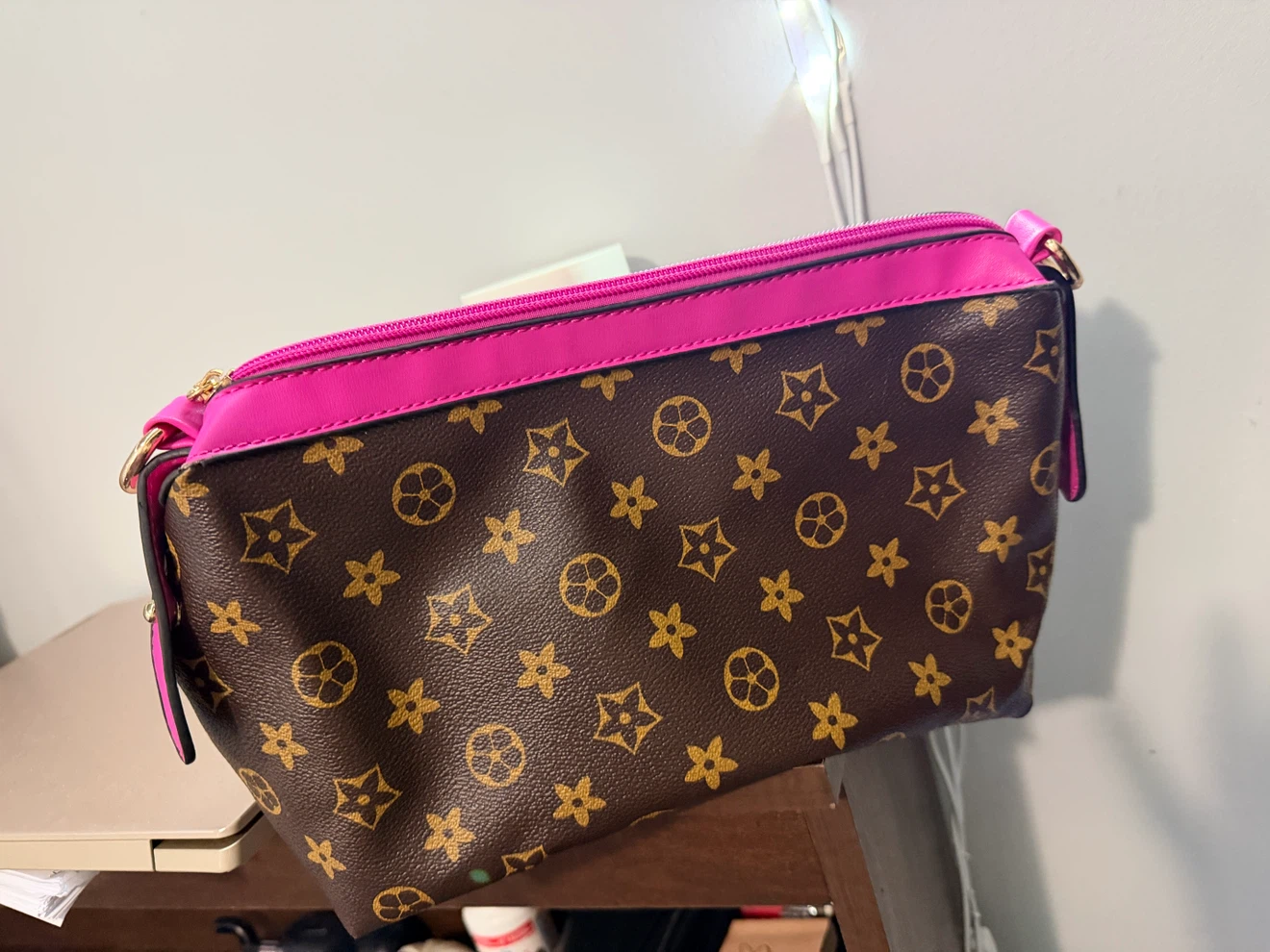 Crossbody bag with pink accents