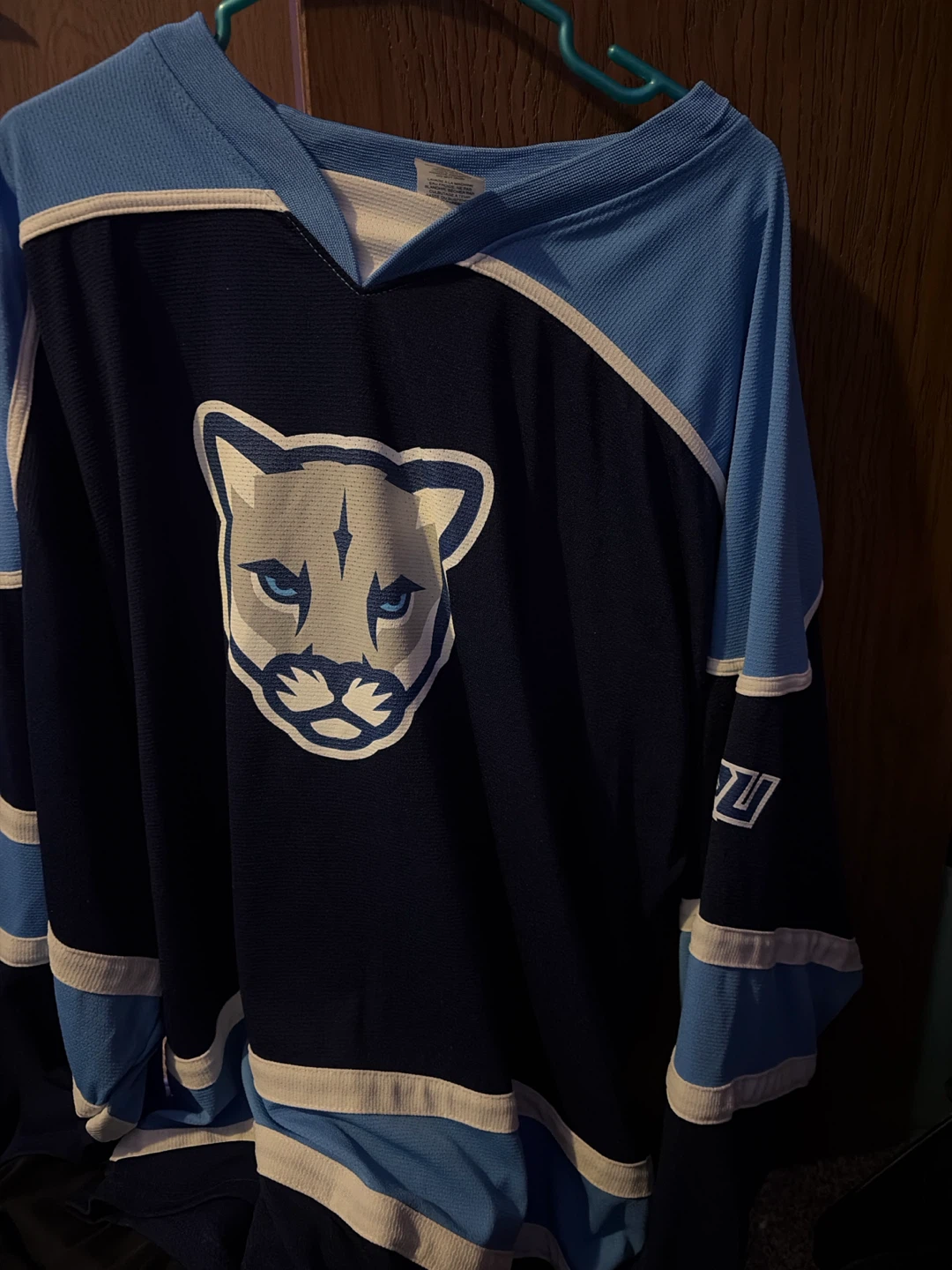 Blue and black cougar jersey