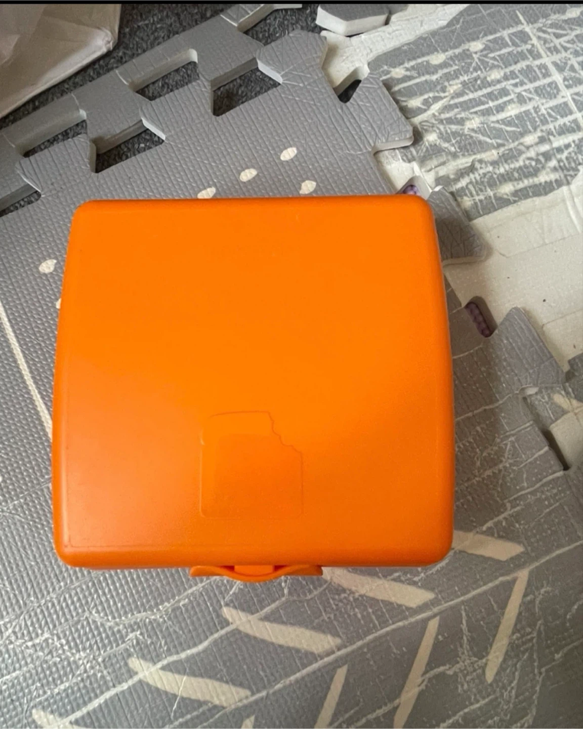 Orange plastic snack container🏈