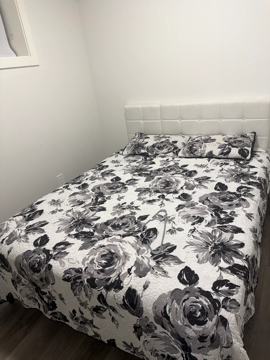White upholstered tufted headboard