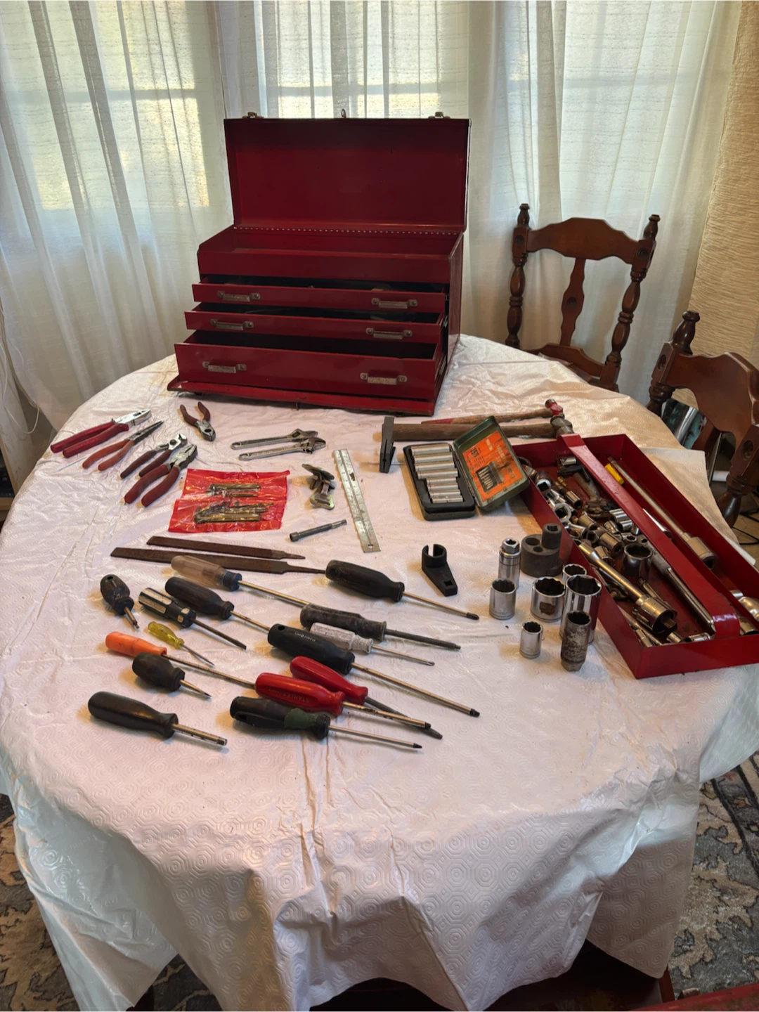 Red Metal Toolbox with Assorted Hand Tools
